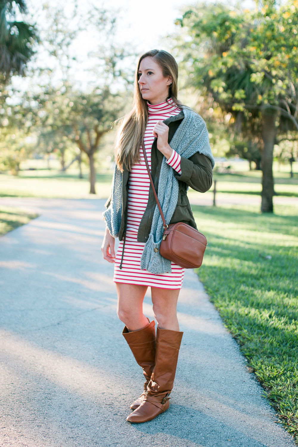7 Winter Outfit Ideas for Warm Weather / Winter Outfit Inspiration / Striped Dress for Winter / Striped Turtleneck Dress / Leather Riding Boots 