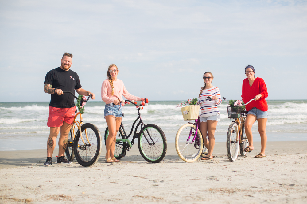 Sweaters to Wear During the Holiday Season | Beach Bike Ride | Winter Outfit Ideas | Christmas in Florida | Beach Bike Ride | Cropped Pink Sweater | Twisted Back Sweater | Red Knit Sweater | Striped Sweater | Friends on a Bike Ride
