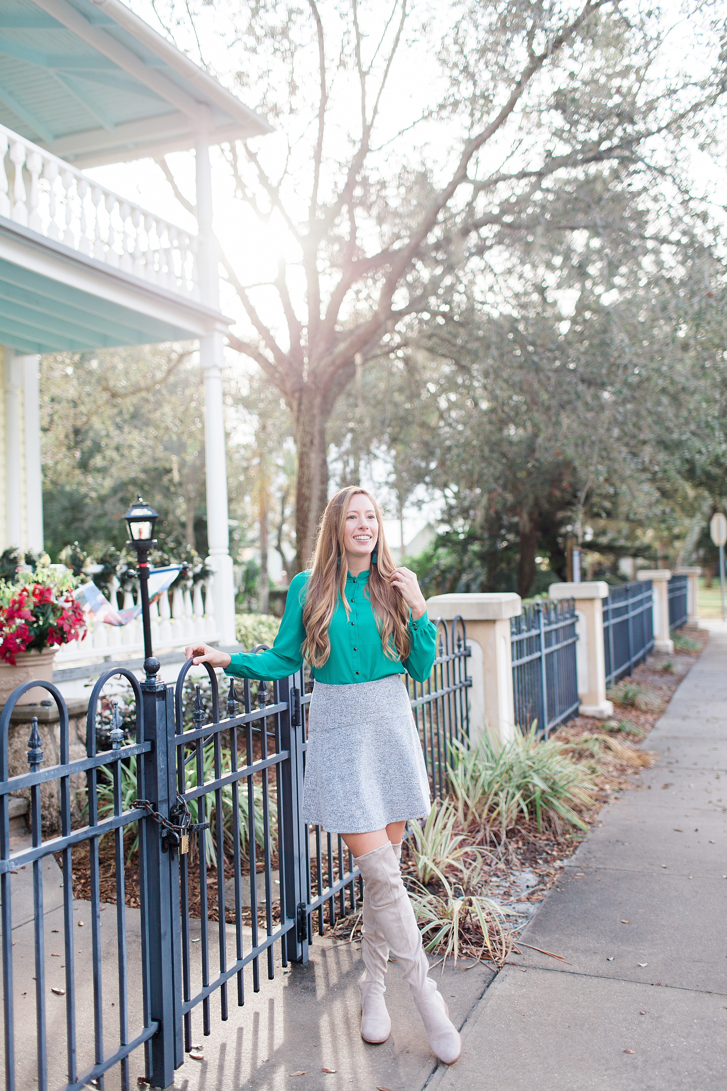 7 Winter Outfit Ideas for Warm Weather / Winter Outfit Inspiration / Grey Skater Skirt / Green Blouse / Grey Over the Knee Boots 