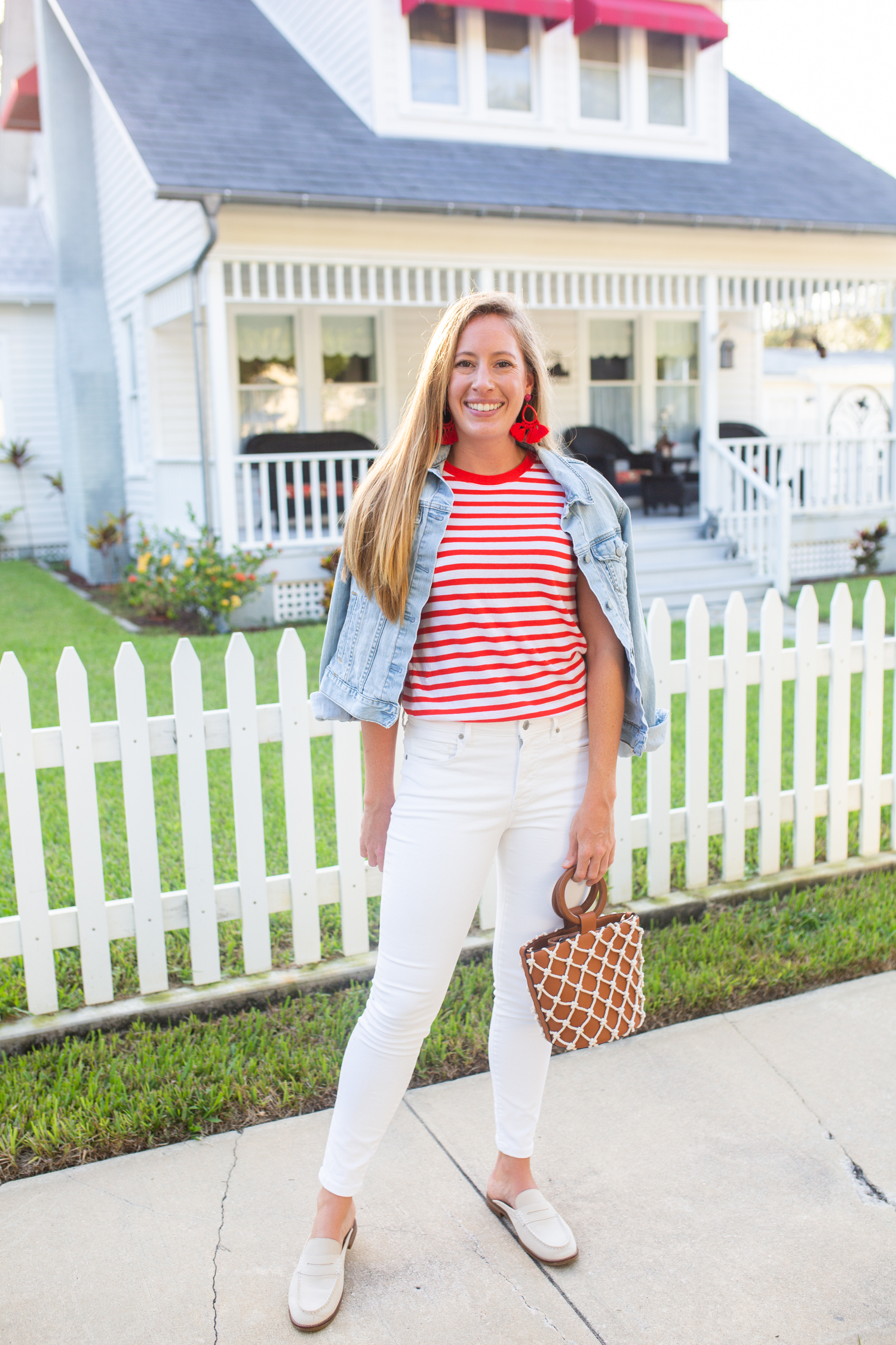 woman wearing Classic Wardrobe Essentials striped shirt and white pants 