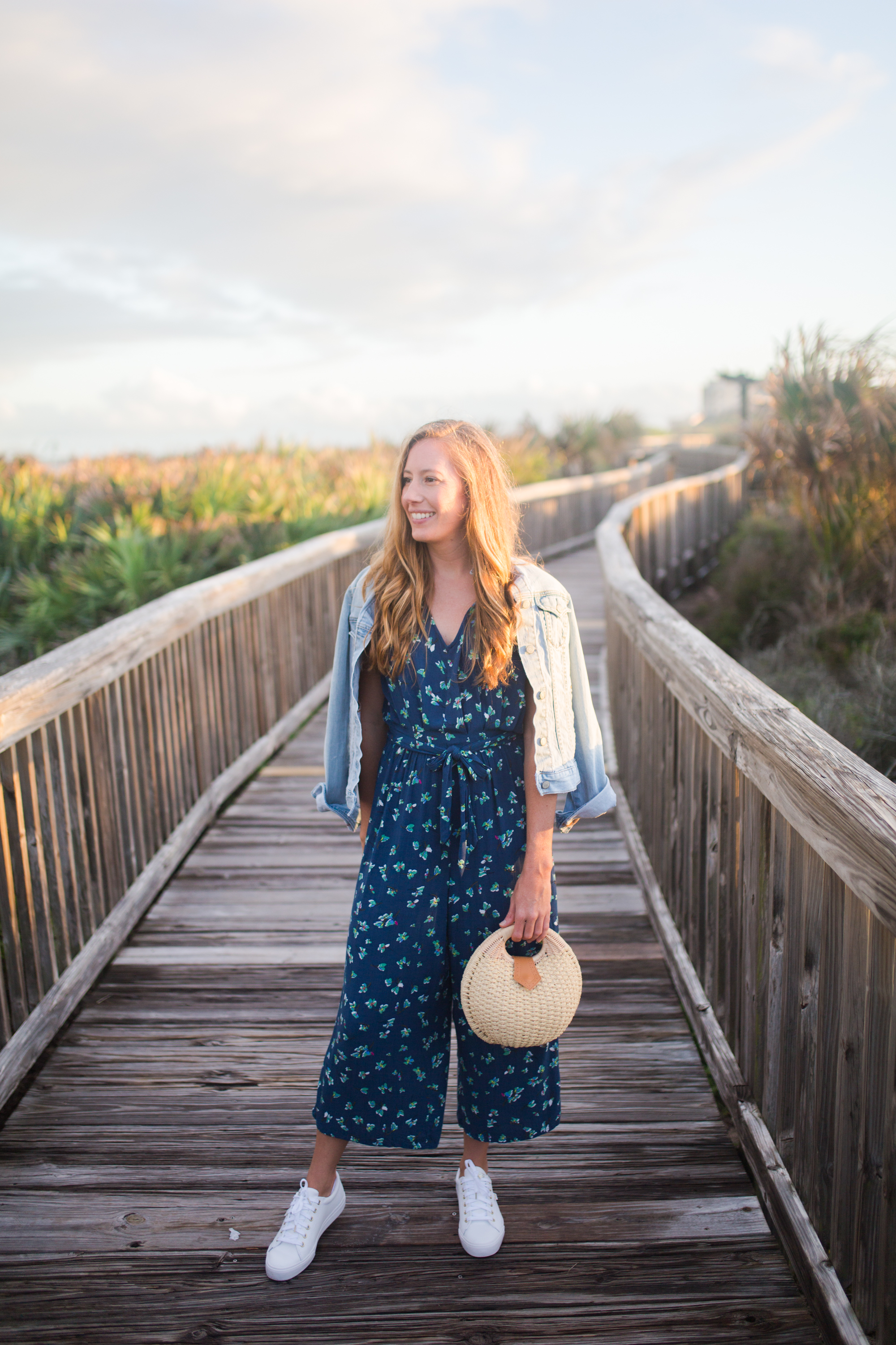 What to Wear on a Tropical Winter Getaway / Blue Floral Jumpsuit / Beach Resort Outfits / Resort Vacation Outfits / Vacay Outfits / Island Outfits Tropical / Beach Weekend Outfit / White Sneakers Outfit - Sunshine Style, A Florida Based Fashion and Lifestyle Blog