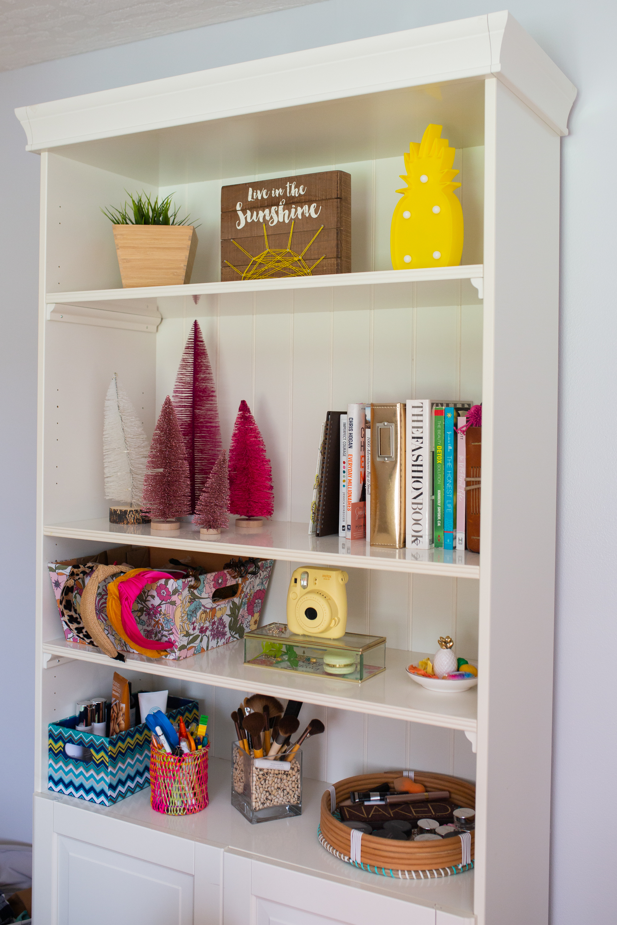 woman sharing Non-Traditional Tropical Christmas Decoration on her cabinet 