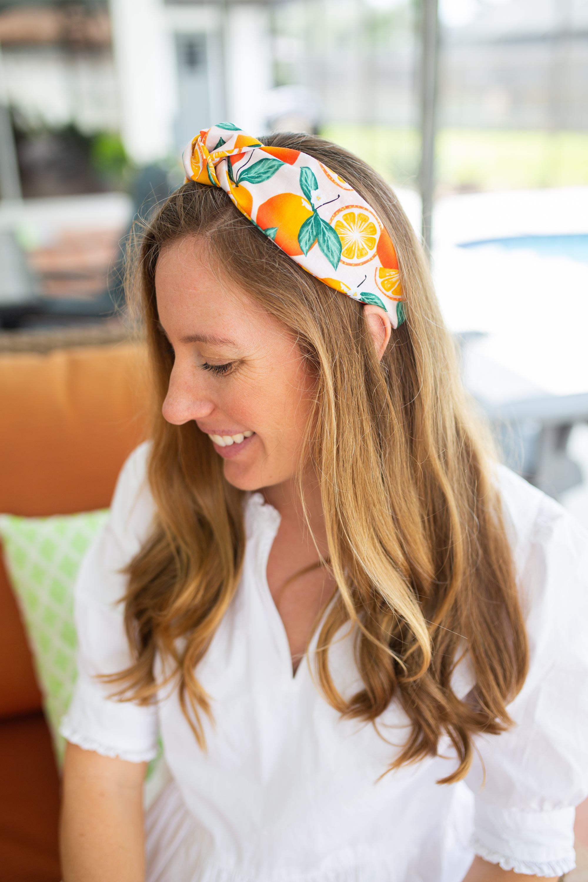 woman in white dress and Sunshine Style Citrus Collection headband 