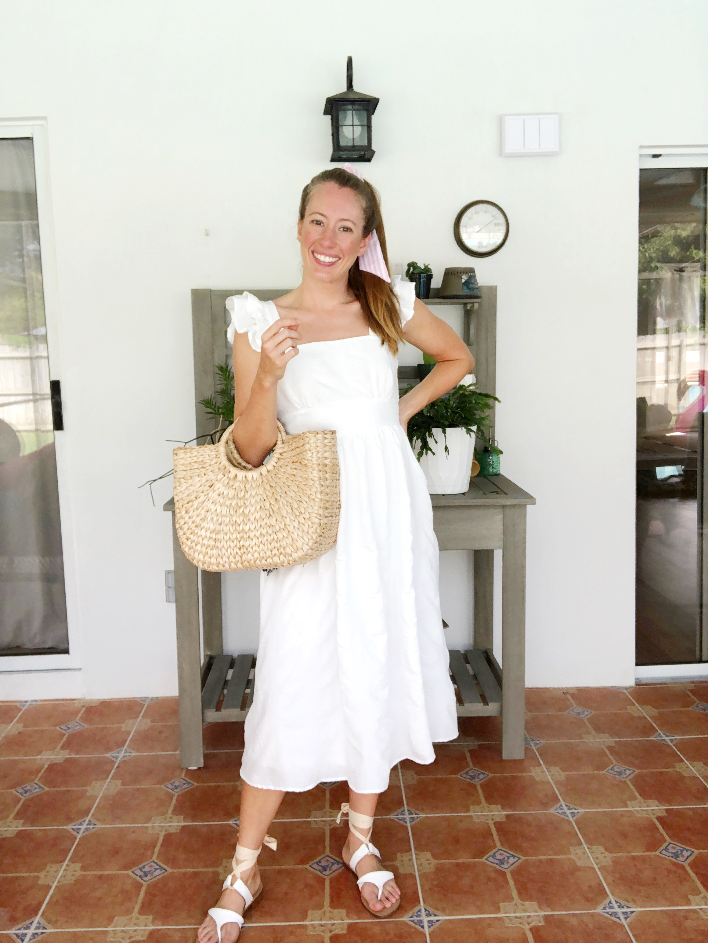 woman wearing white Beach Vacation Outfit dress