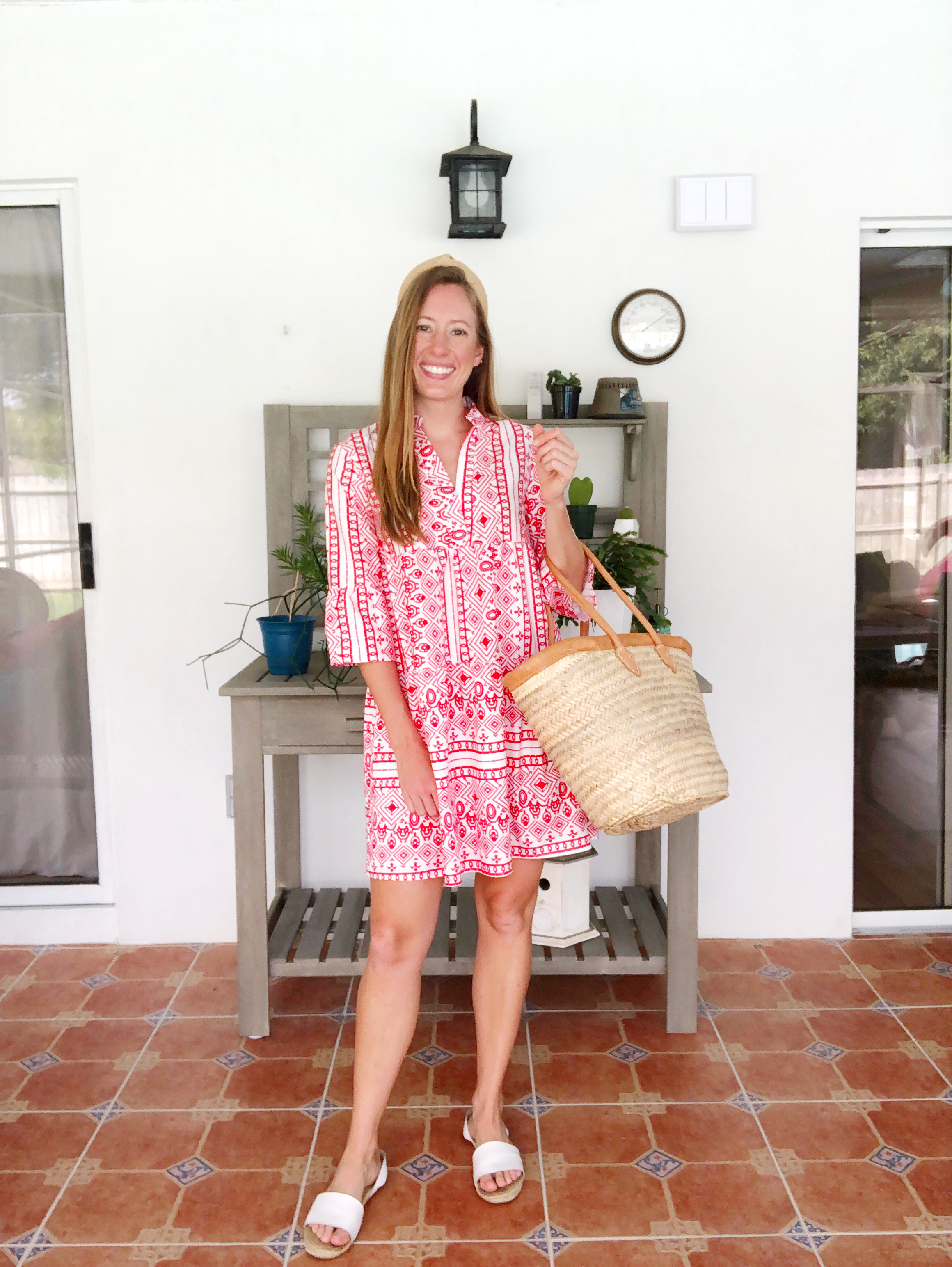 woman wearing printed red and white dress for Beach Vacation Outfit