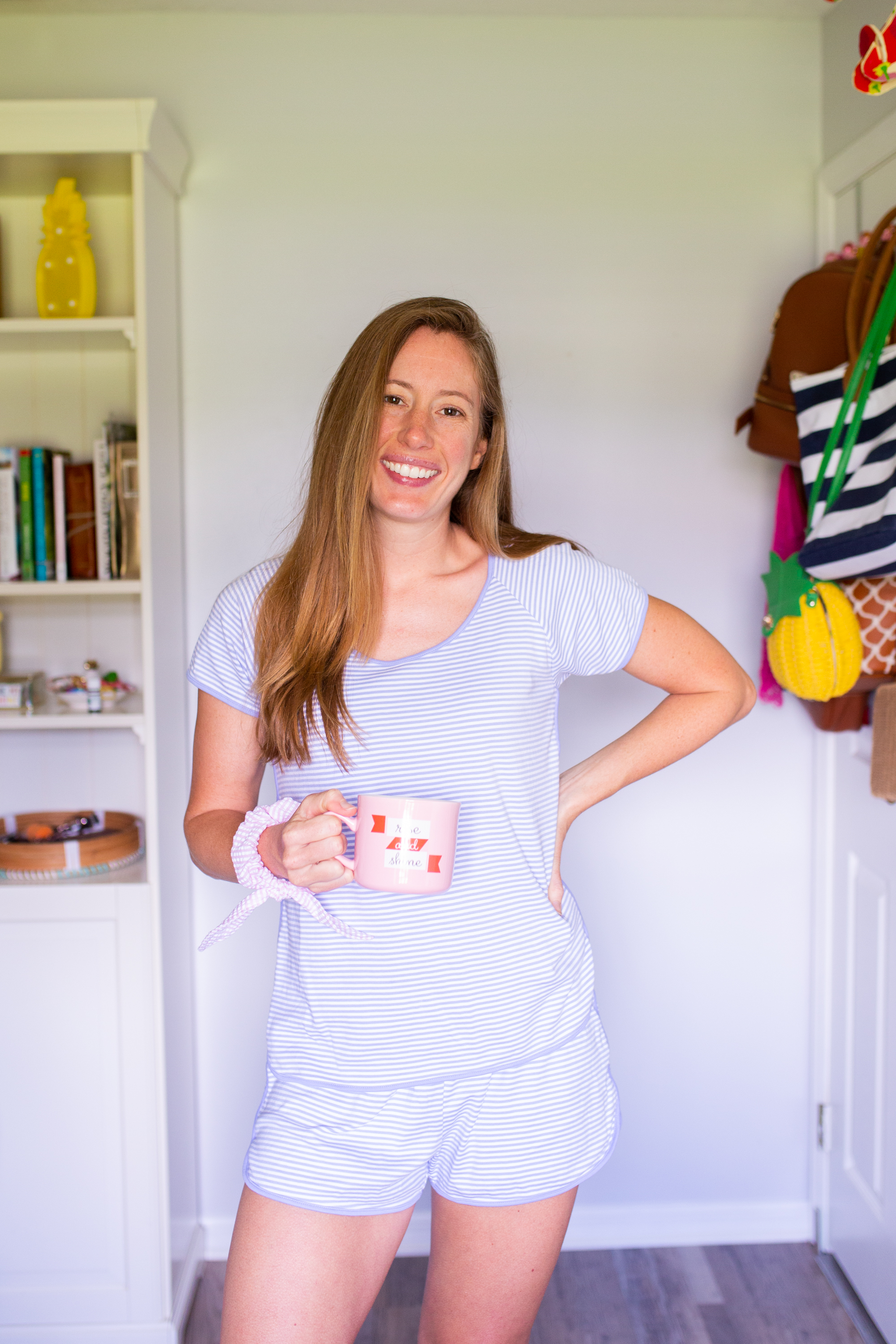 woman holding a pink mug and sharing Lake Pajamas Review