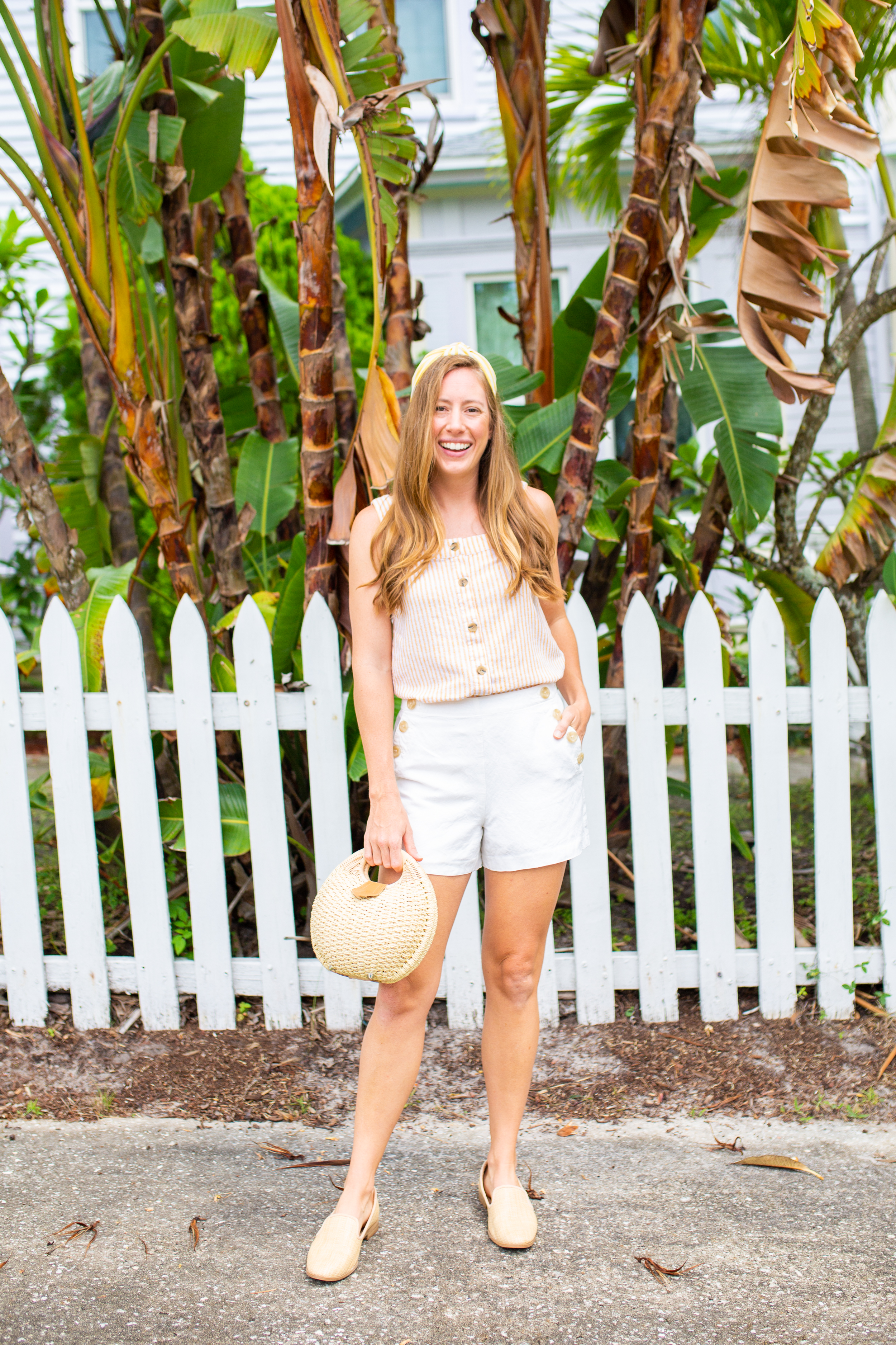 woman wearing top, white shorts, and Sunshine Style Co. Summer headband 