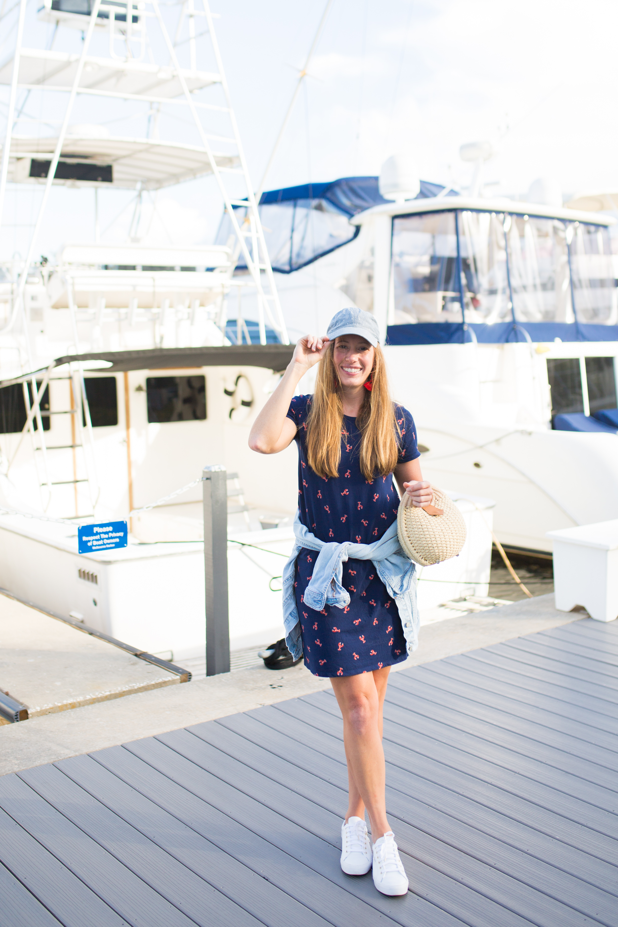 woman sharing Ways to Wear a T-Shirt Dress by wearing a cap and jacket 