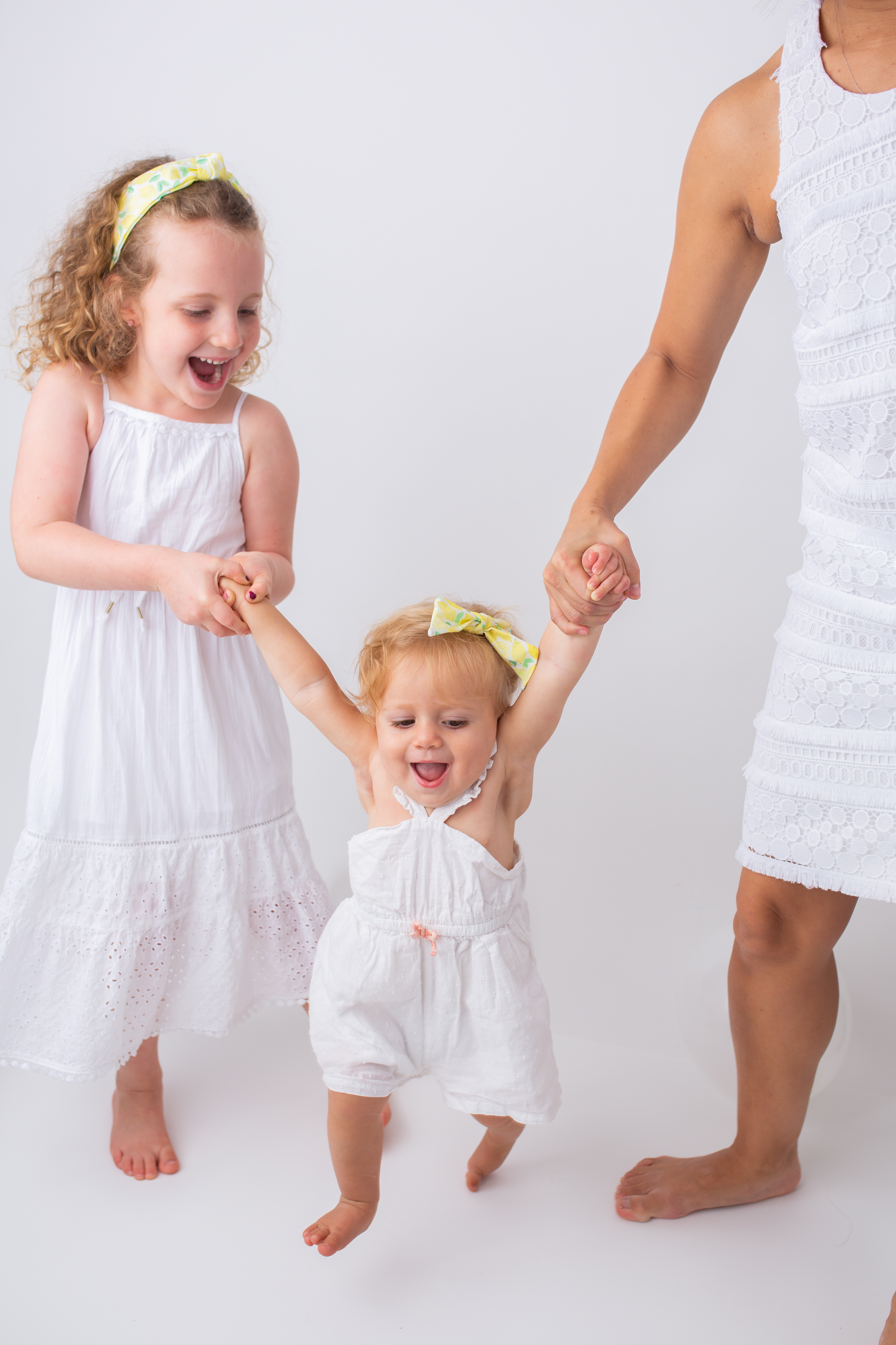 mom and kids wearing white dresses and Sunshine Style Headbands