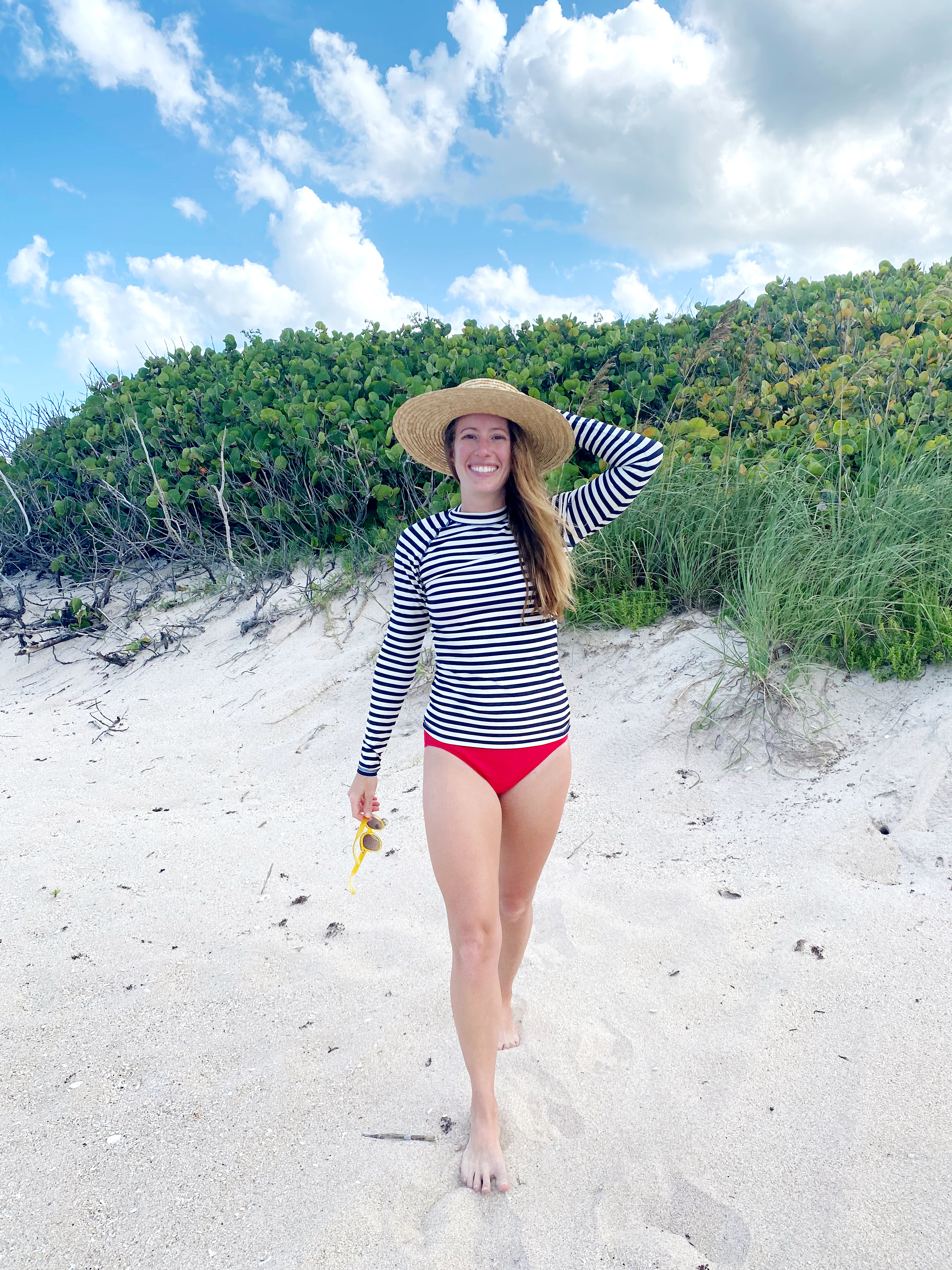 woman wearing Striped Rash Guards  and weaved hat