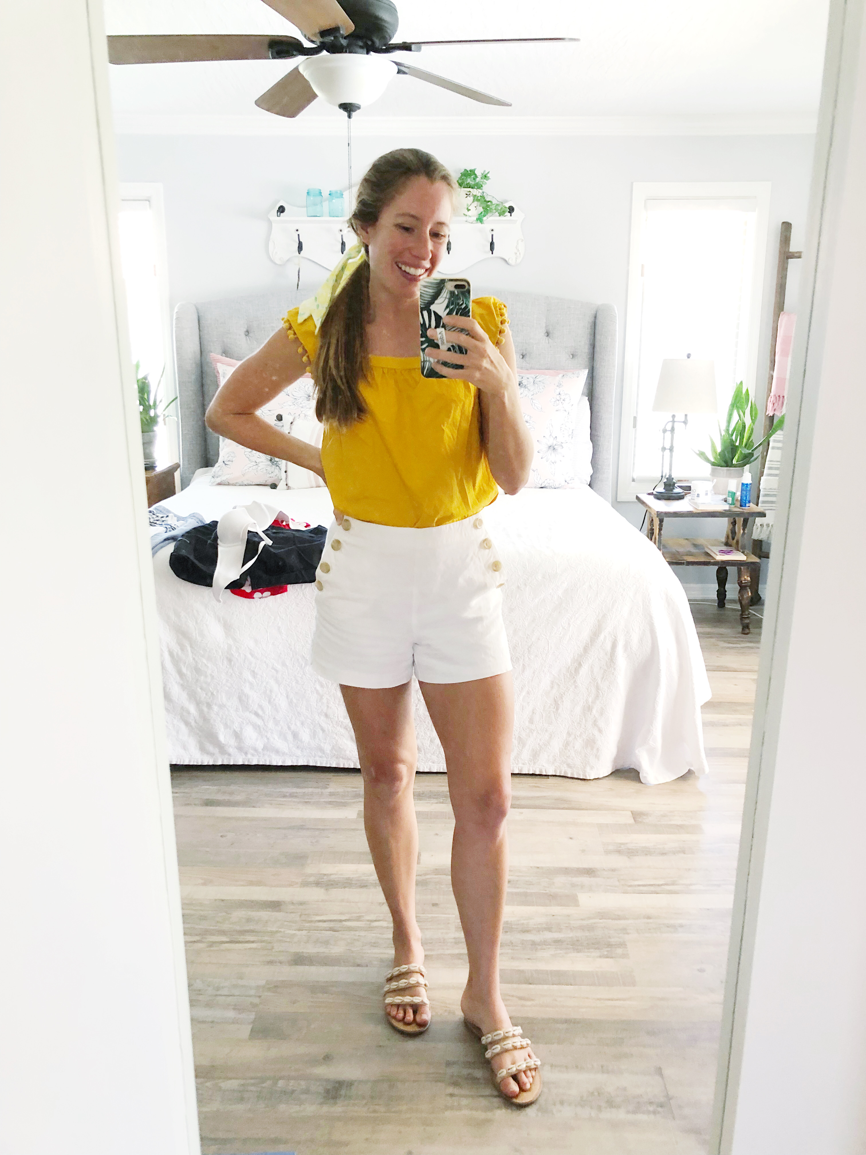 woman wearing yellow top and white shorts for Sunny List No 6