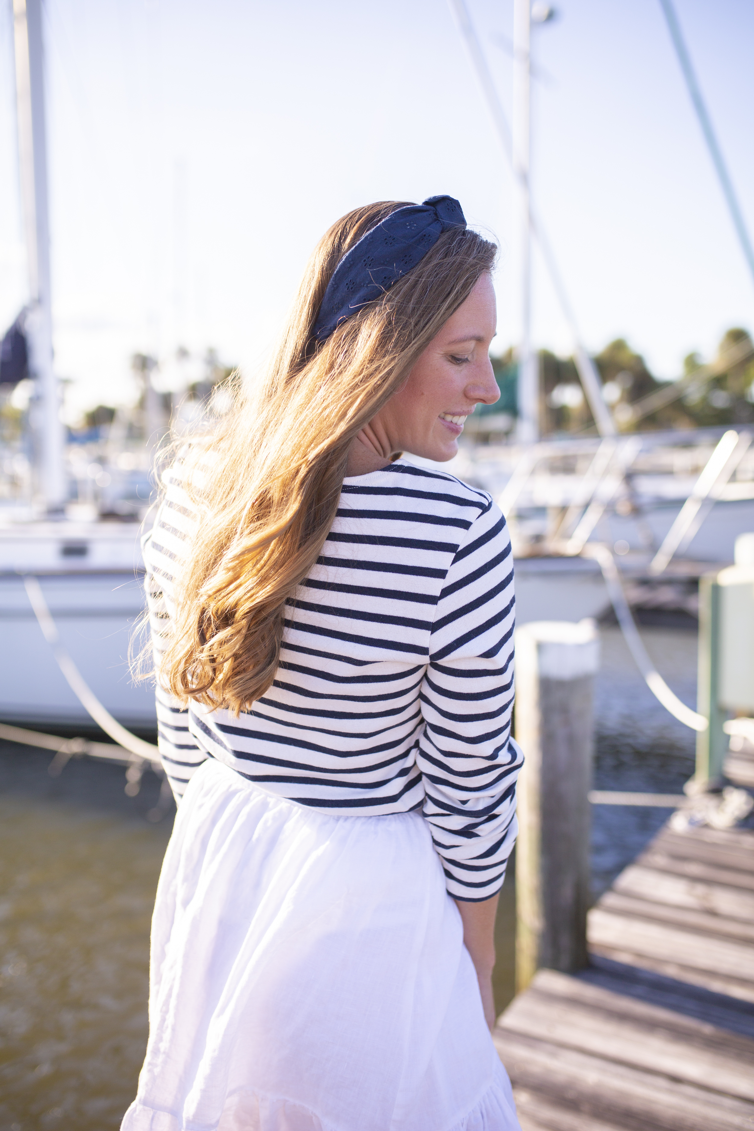 woman in Saint James Breton Striped Shirt and blue headband 