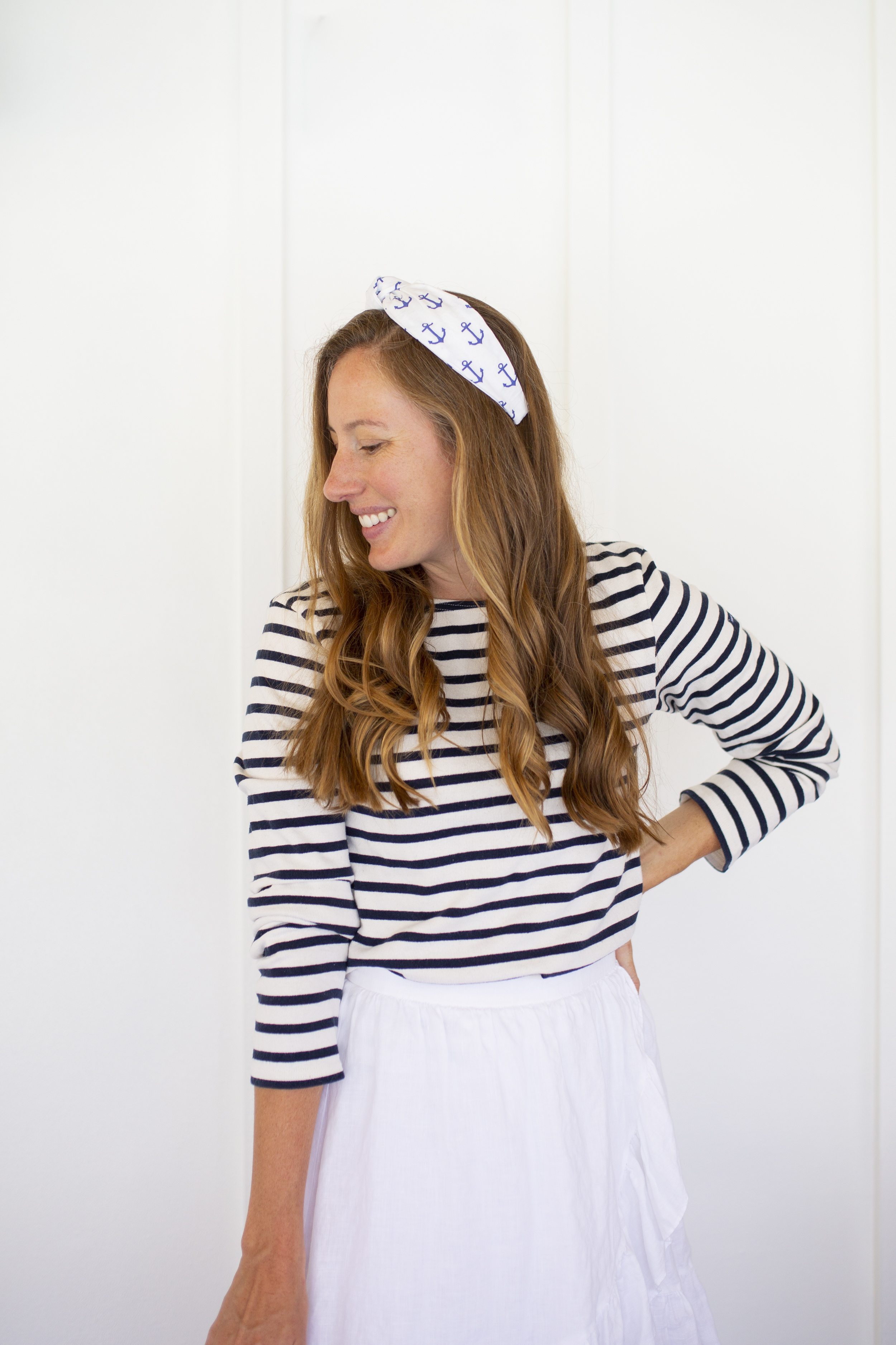 woman in Saint James Breton Striped Shirt and naval print headband 