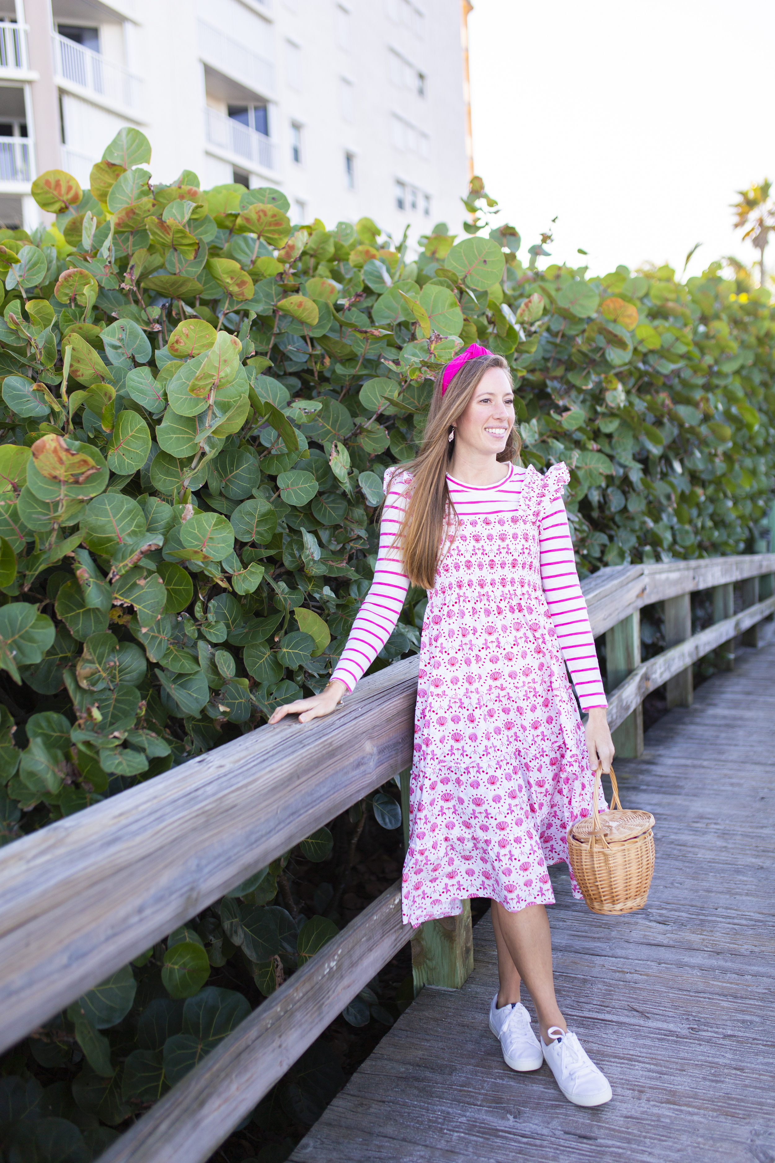 woman sharing Styling a Nap Dress in pink long sleeves