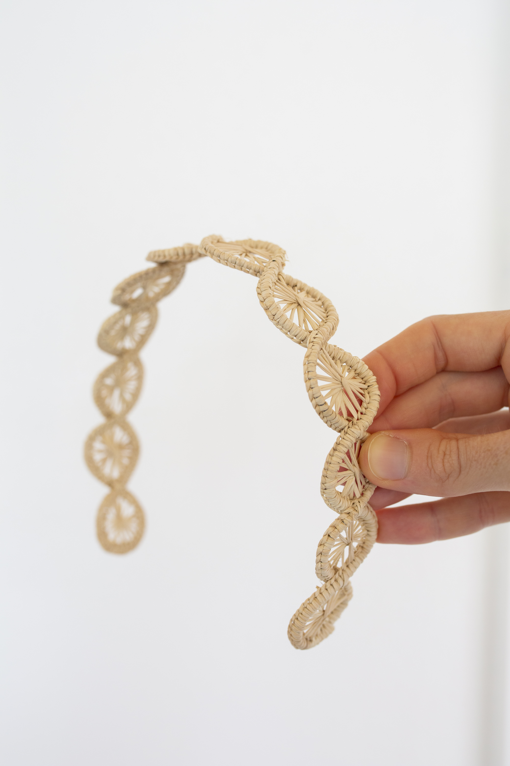 Natural Handmade Woven Palm Headband on white background 