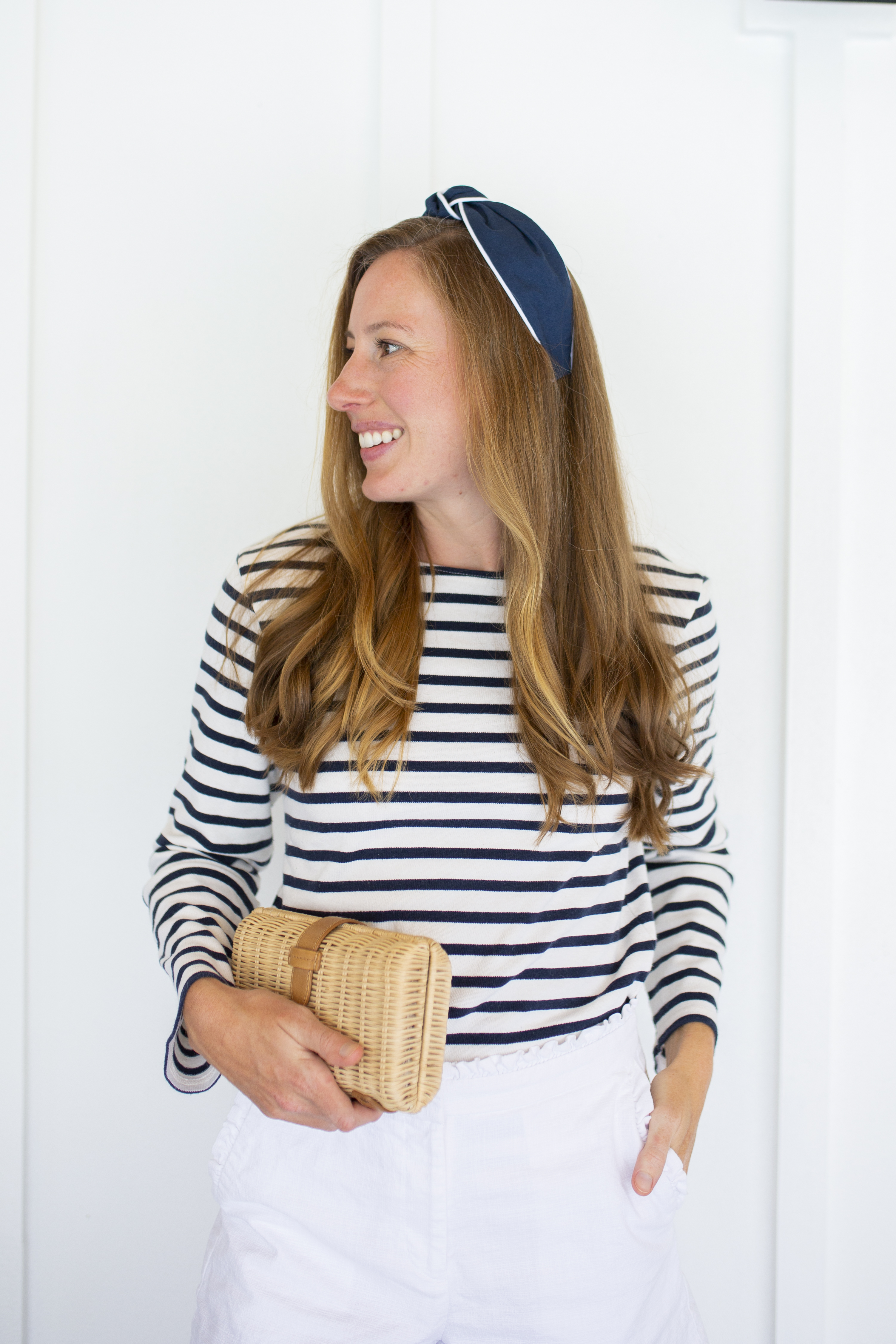 Sunshine Style Co. navy and white piped headband a long sleeve striped top with white shorts and straw bag 